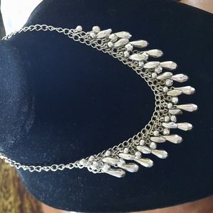 Silver metal statement necklace.